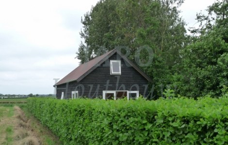 Houten huis met zonnepanelen in Heerhugowaard