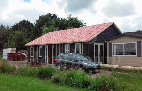 Houten seniorenwoning in de tuin bouwen